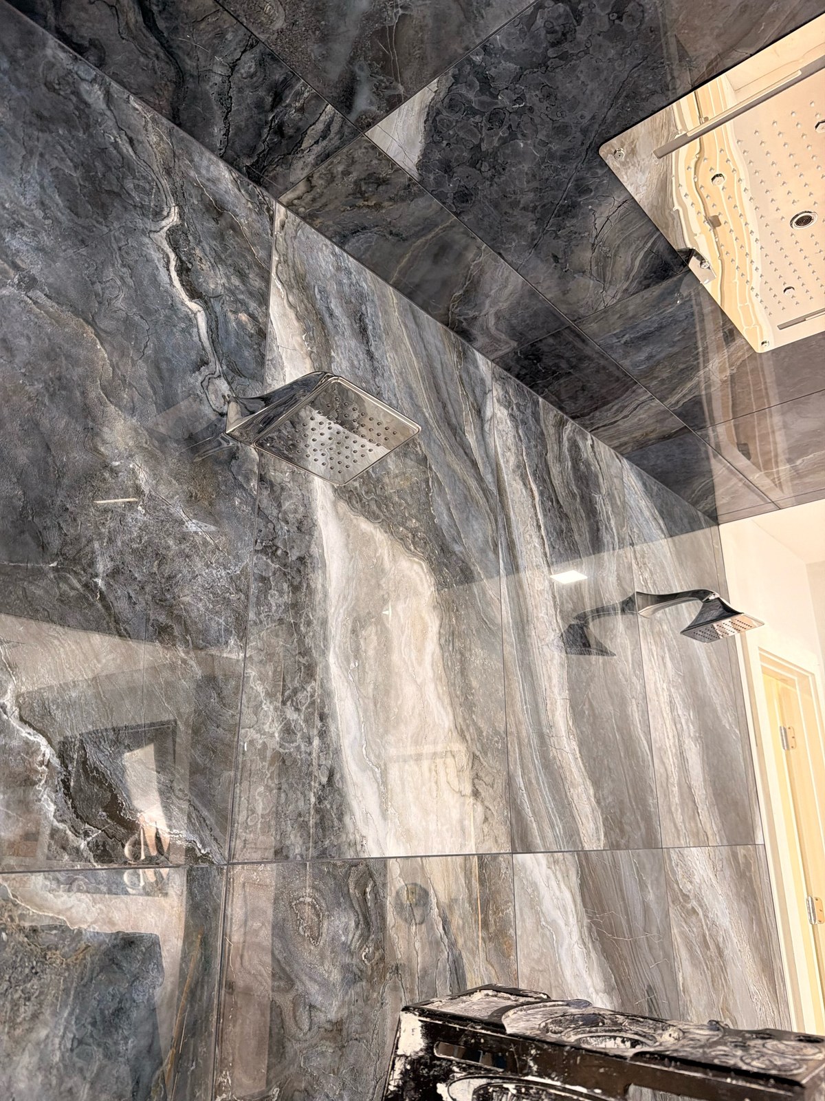 Luxury marble shower with rainfall head and square chrome body sprays